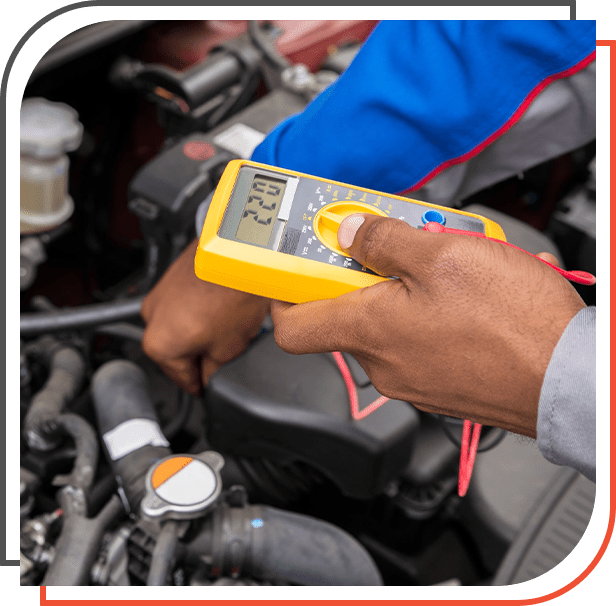 Close-up Of Mechanic checking and charging A Car Battery